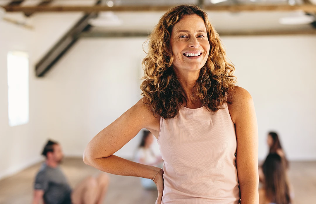 Woman smiling in exercise class